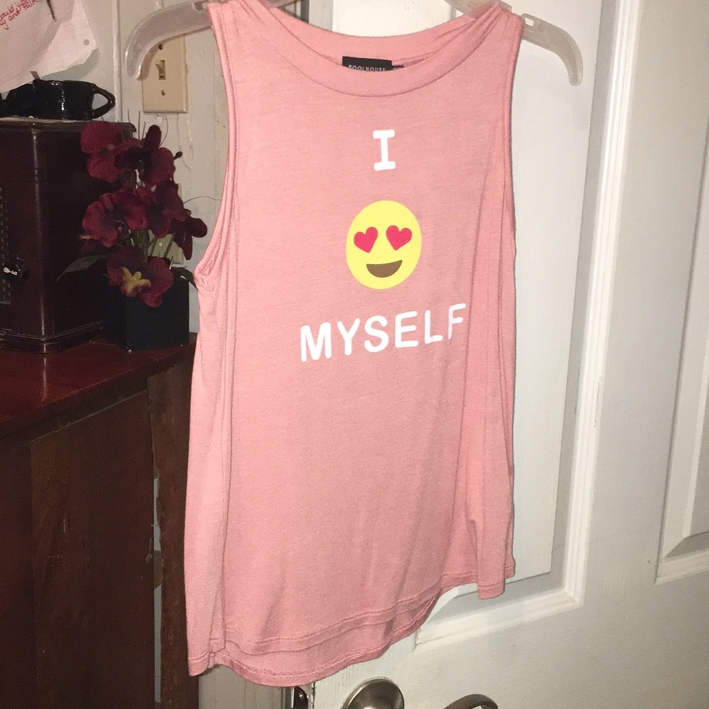 A pink tank top with a emoji.